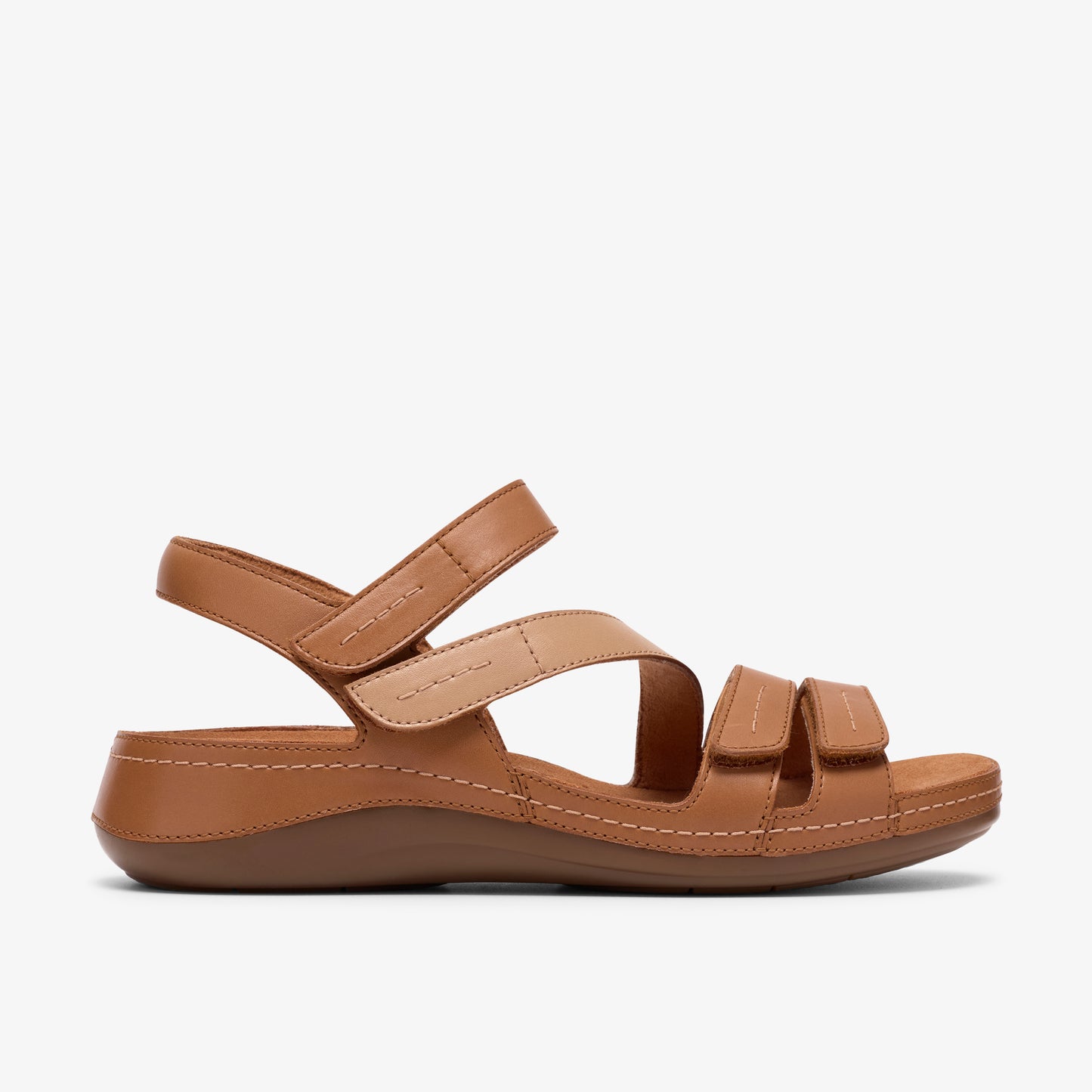 Tan-colored sandal with adjustable velcro straps.