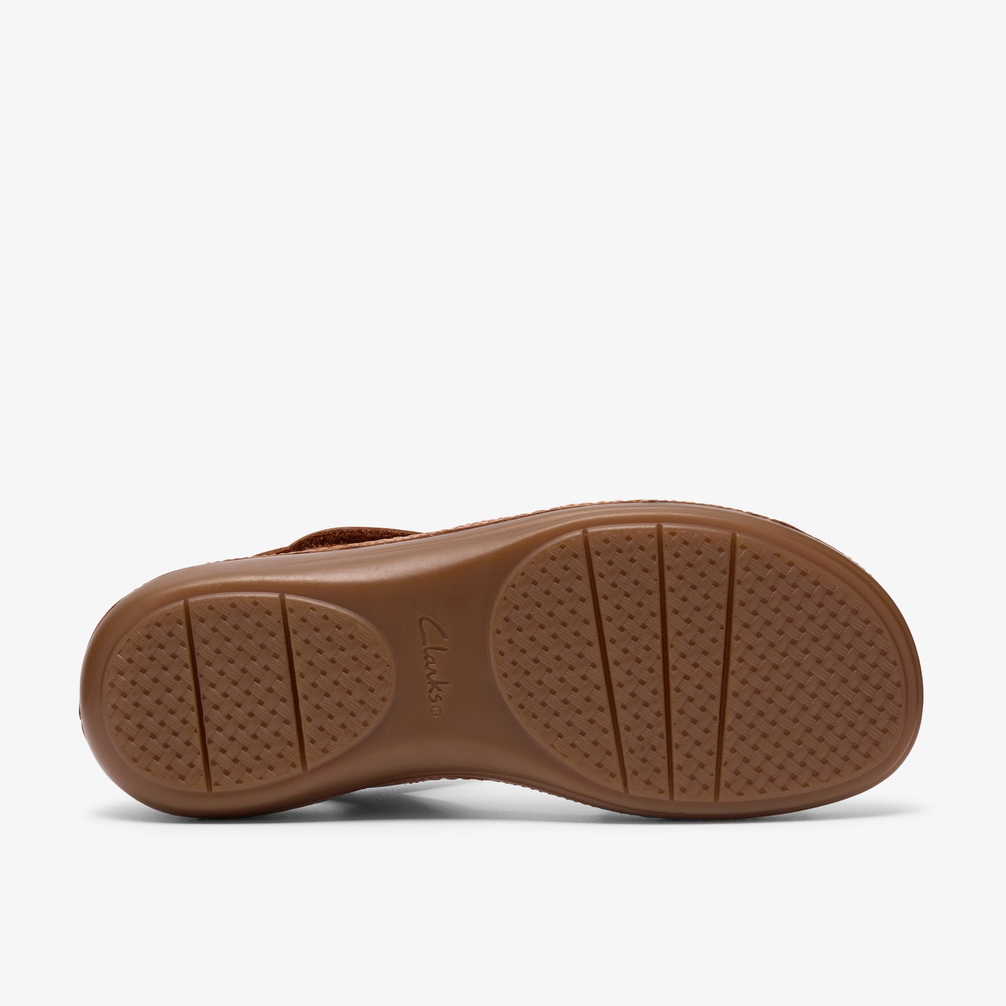 Brown sandal sole with textured circular treads and horizontal lines.
