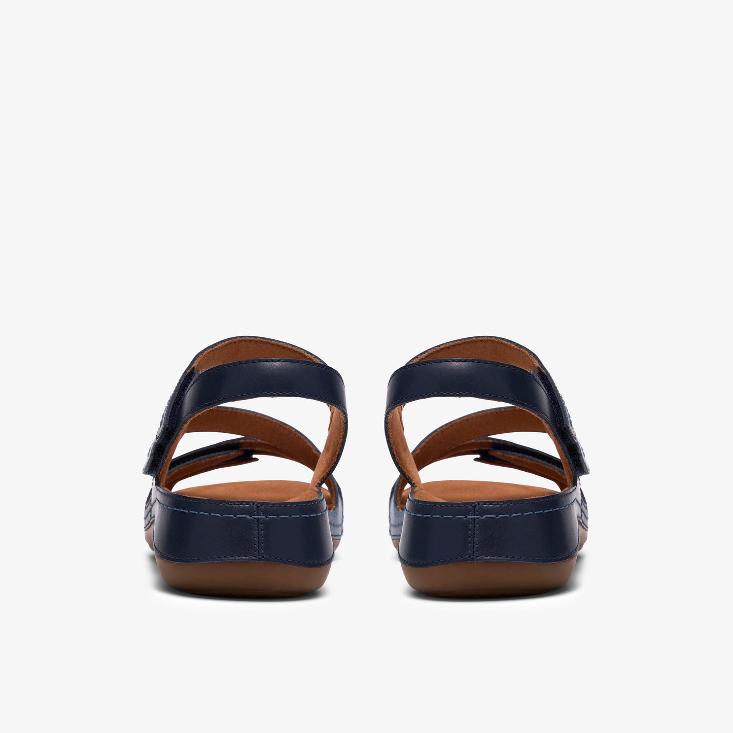 Rear view of navy blue sandals with two straps and a hook-and-loop closure.