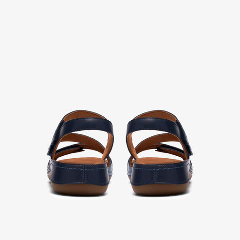 Rear view of navy blue sandals with two straps and a hook-and-loop closure.