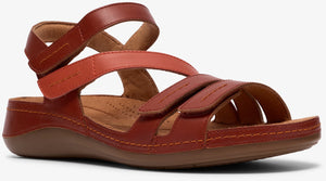 Red leather sandals with adjustable velcro straps and a contoured footbed.