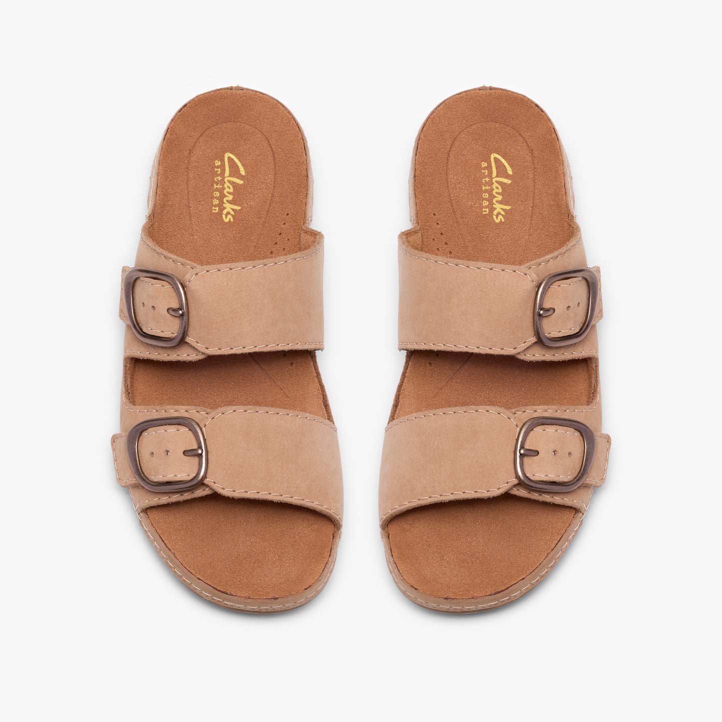 Two beige sandals each featuring two straps with buckles.