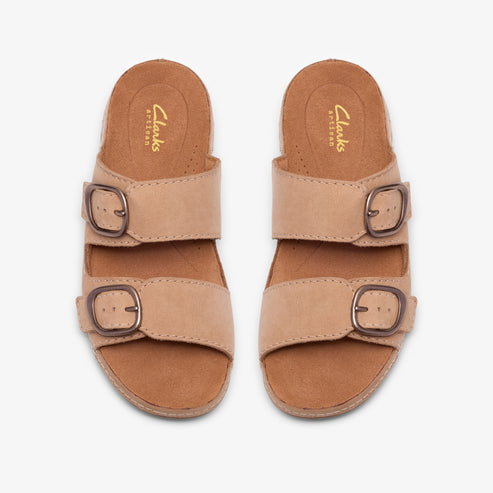 Two beige sandals each featuring two straps with buckles.