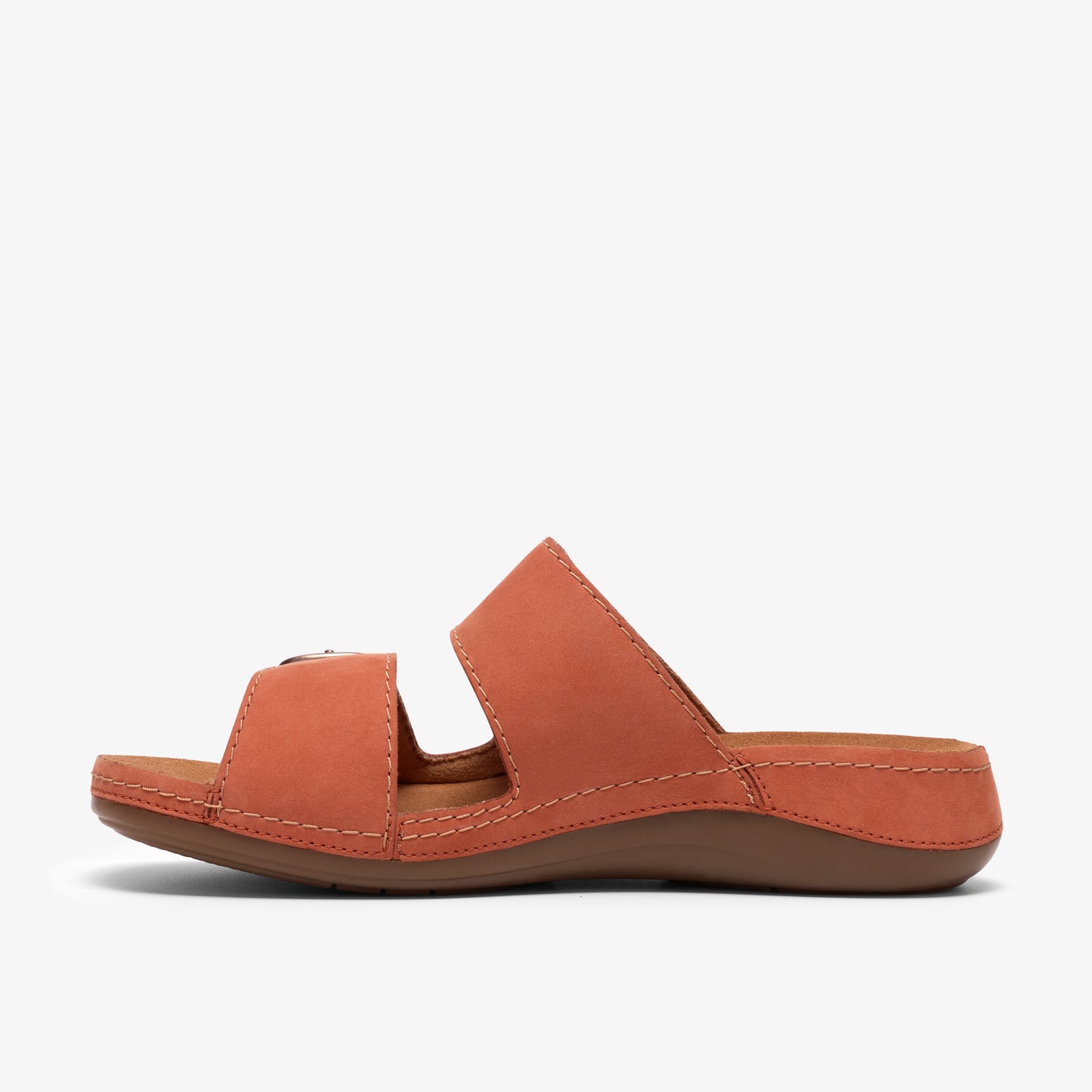 Sandal with orange straps, brown sole, and silver buckle.