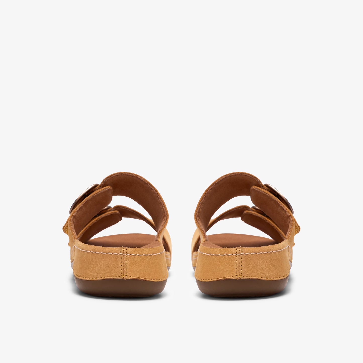 A pair of tan sandals with two adjustable buckle straps.