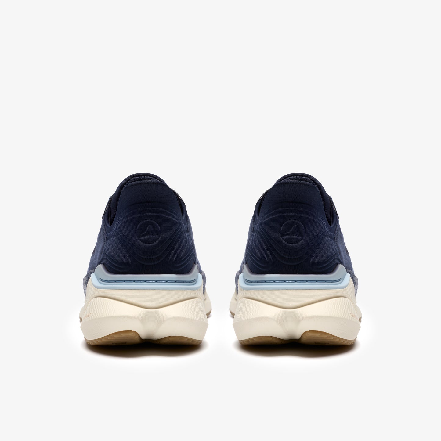 A pair of navy blue athletic shoes with tan soles.