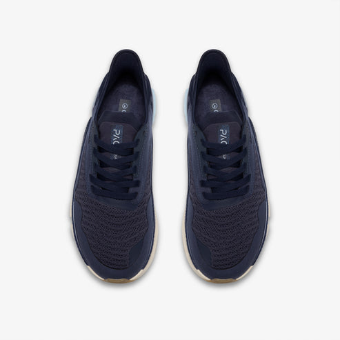 Pair of navy sneakers with laces, viewed from above.