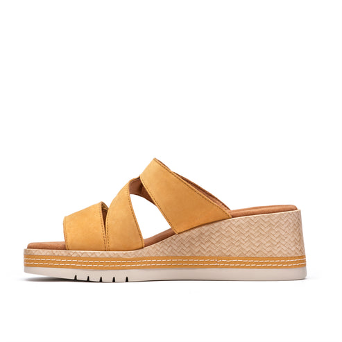 Yellow platform sandal with cross straps.