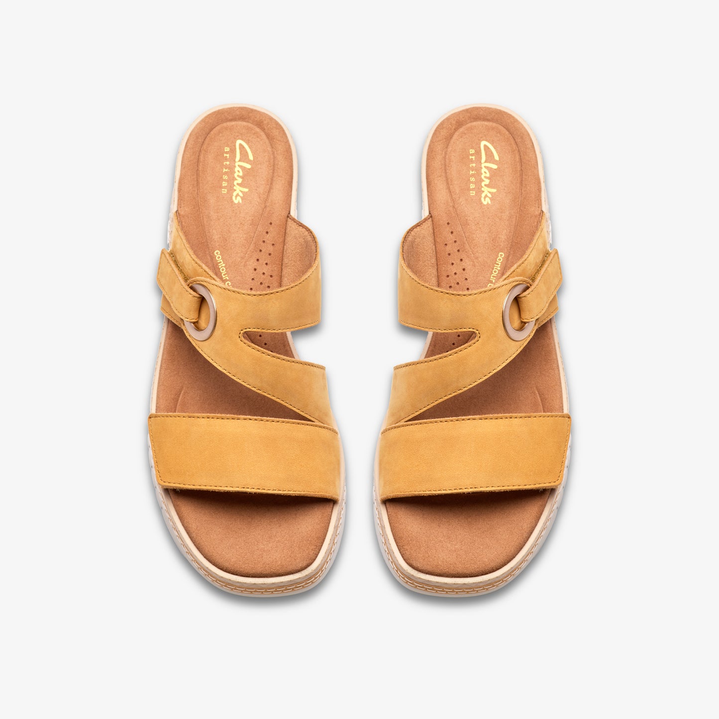 Pair of yellow leather slide sandals with adjustable straps.