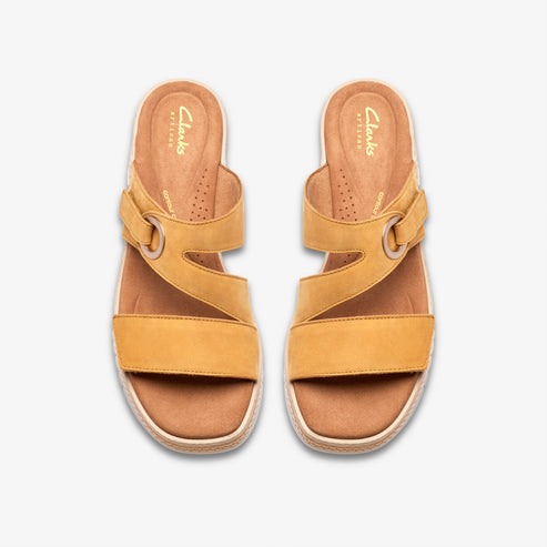 Pair of yellow leather slide sandals with adjustable straps.