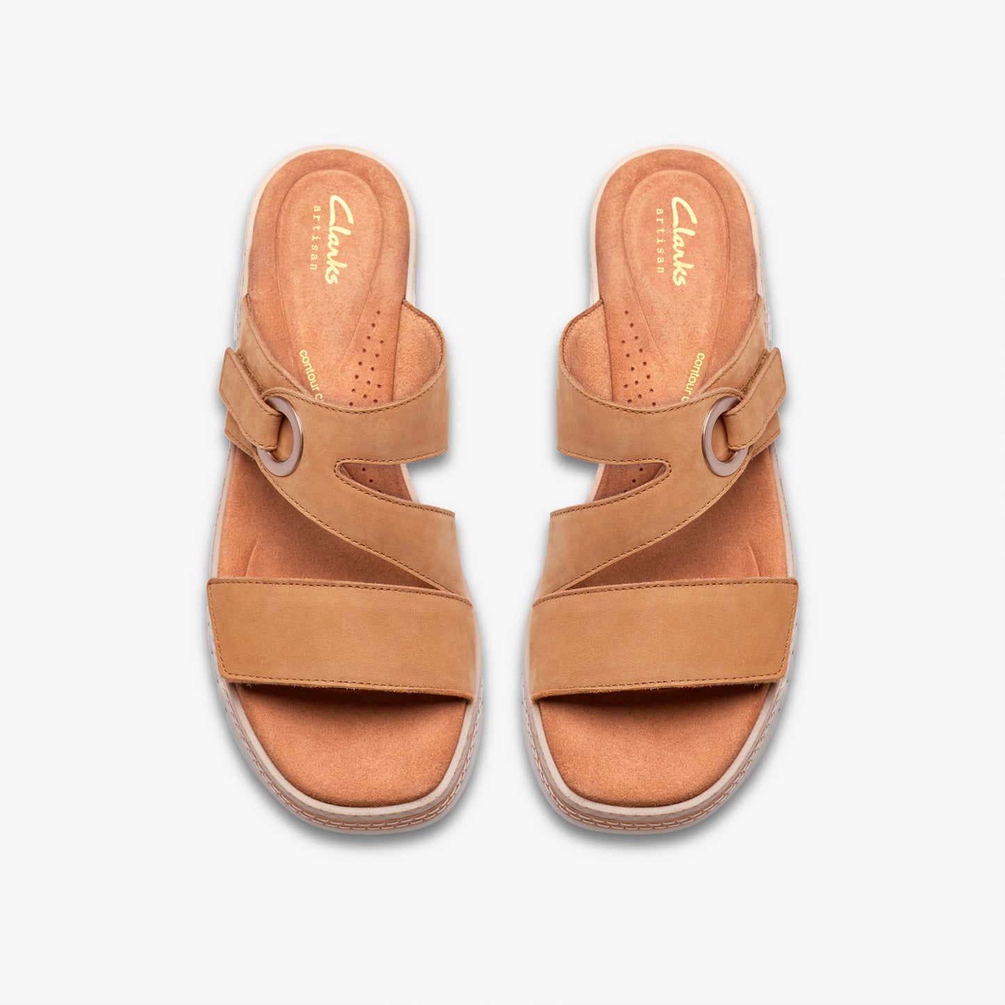 Pair of tan leather sandals with criss-cross straps and adjustable buckle.