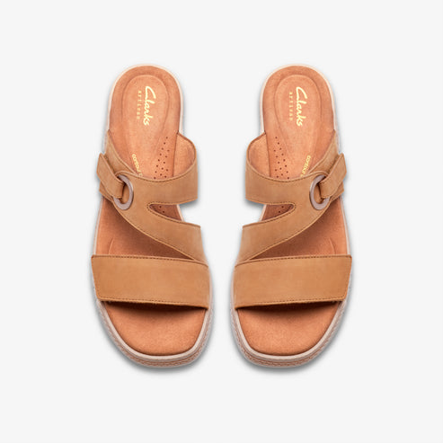 Pair of tan leather sandals with criss-cross straps and adjustable buckle.