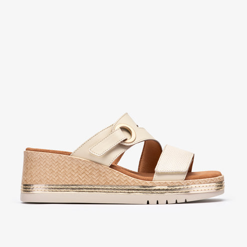 Beige wedge sandal with interwoven straw-like design and adjustable strap.
