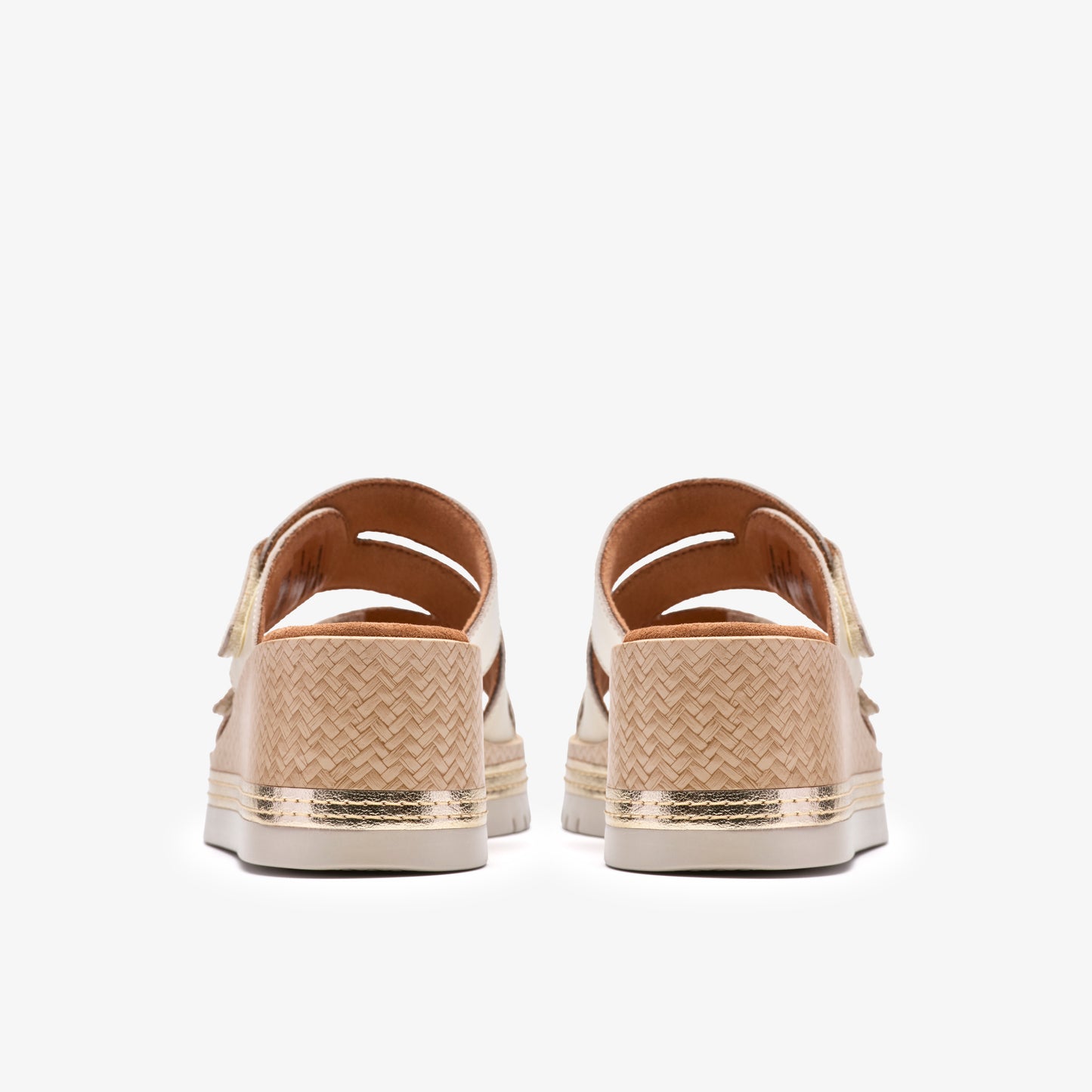 Back view of two beige woven slide sandals with gold accents.