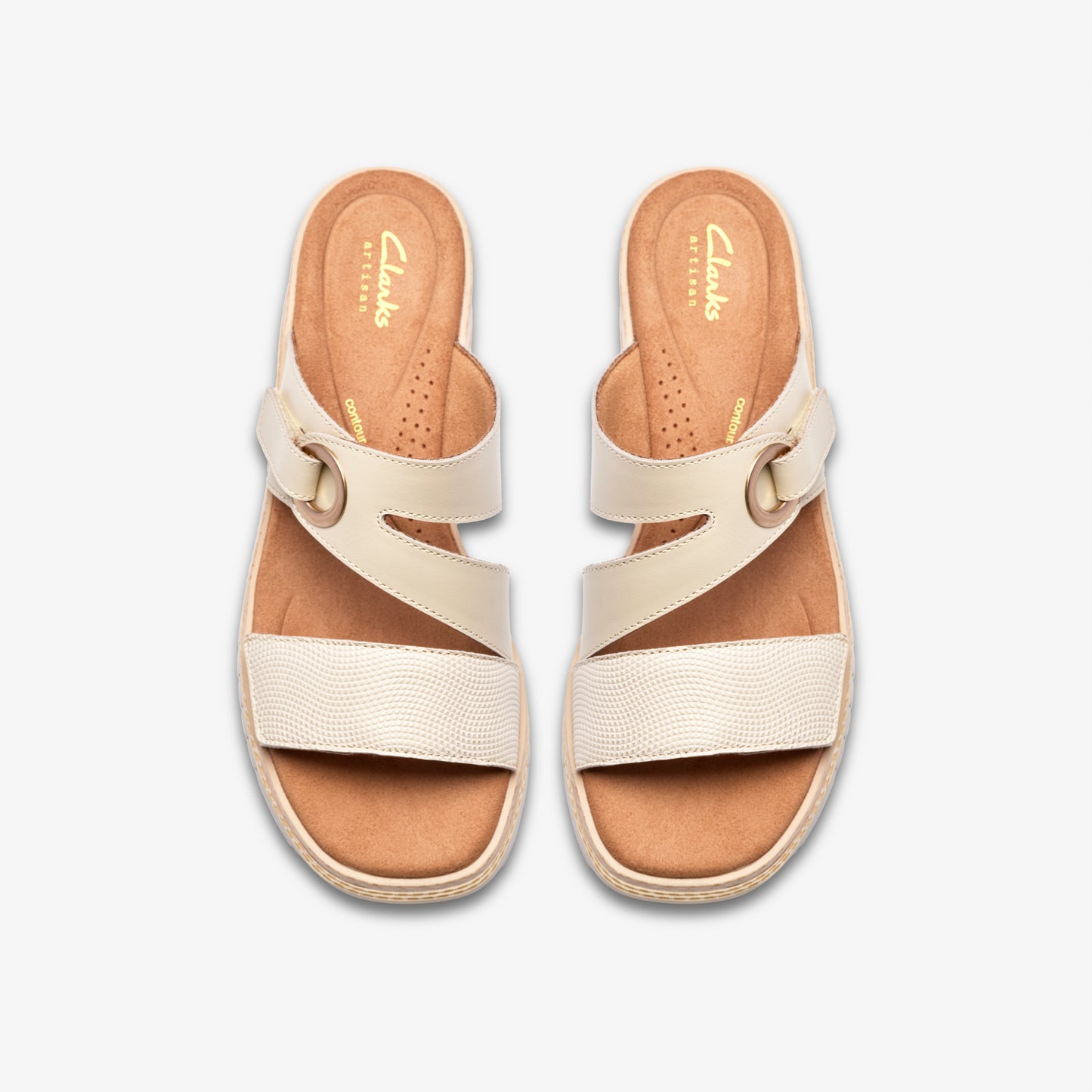 Top-down view of two cream-colored sandals with horizontal and angled straps and gold buckles. "Clarks" printed on insoles.