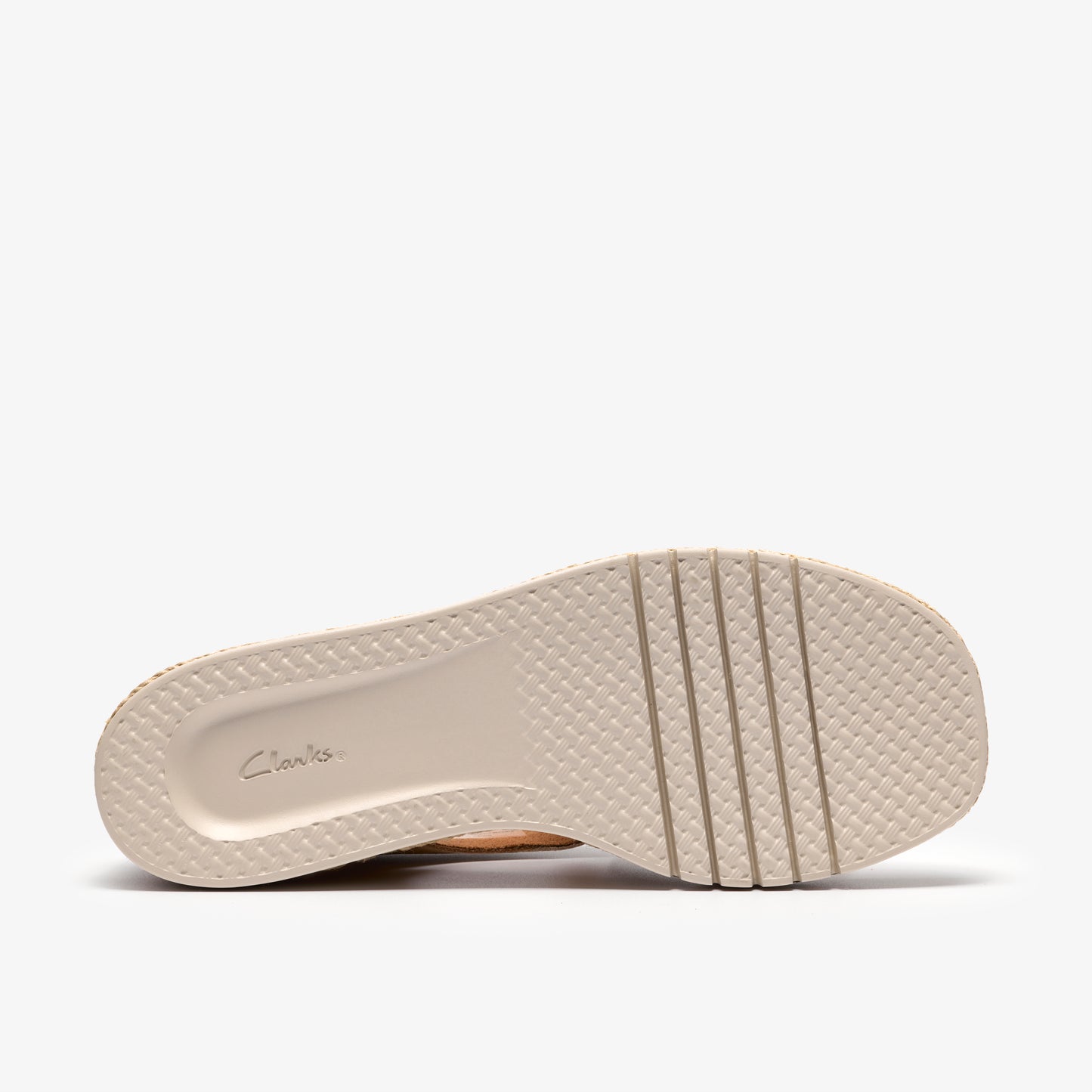 Beige shoe outsole with grooved texture and logo imprint.