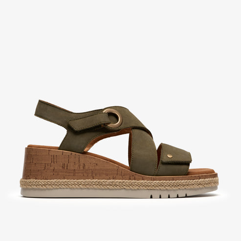 Olive green wedge sandal with cork platform and adjustable straps.