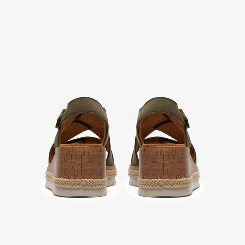 Pair of olive green, open-toed sandals with faux cork platform wedge heels.