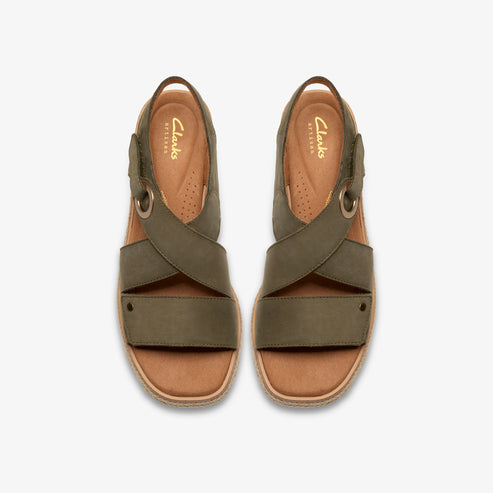 Pair of olive green criss-cross strap sandals with cork soles.