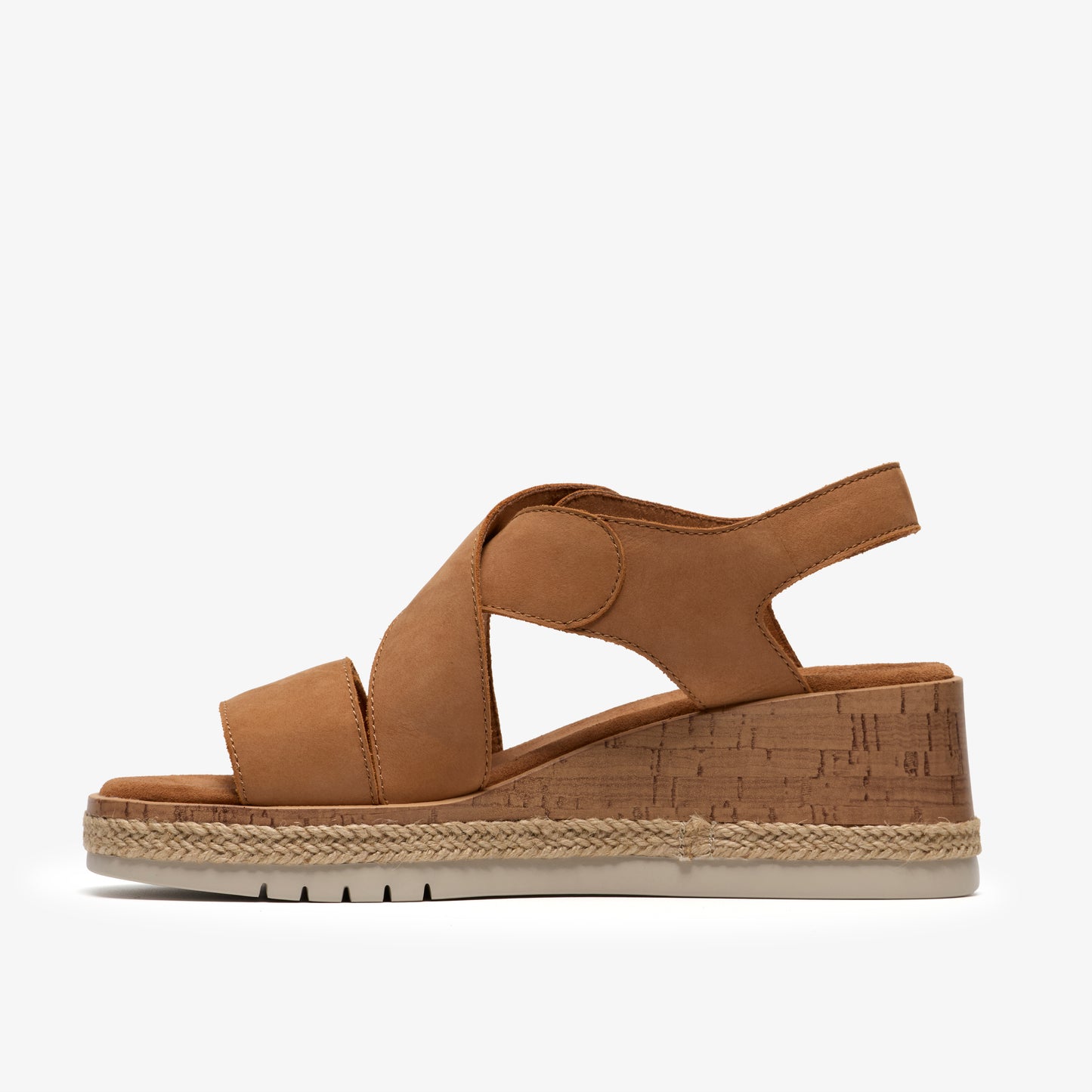Tan wedge sandal with criss-cross straps and adjustable ankle strap.