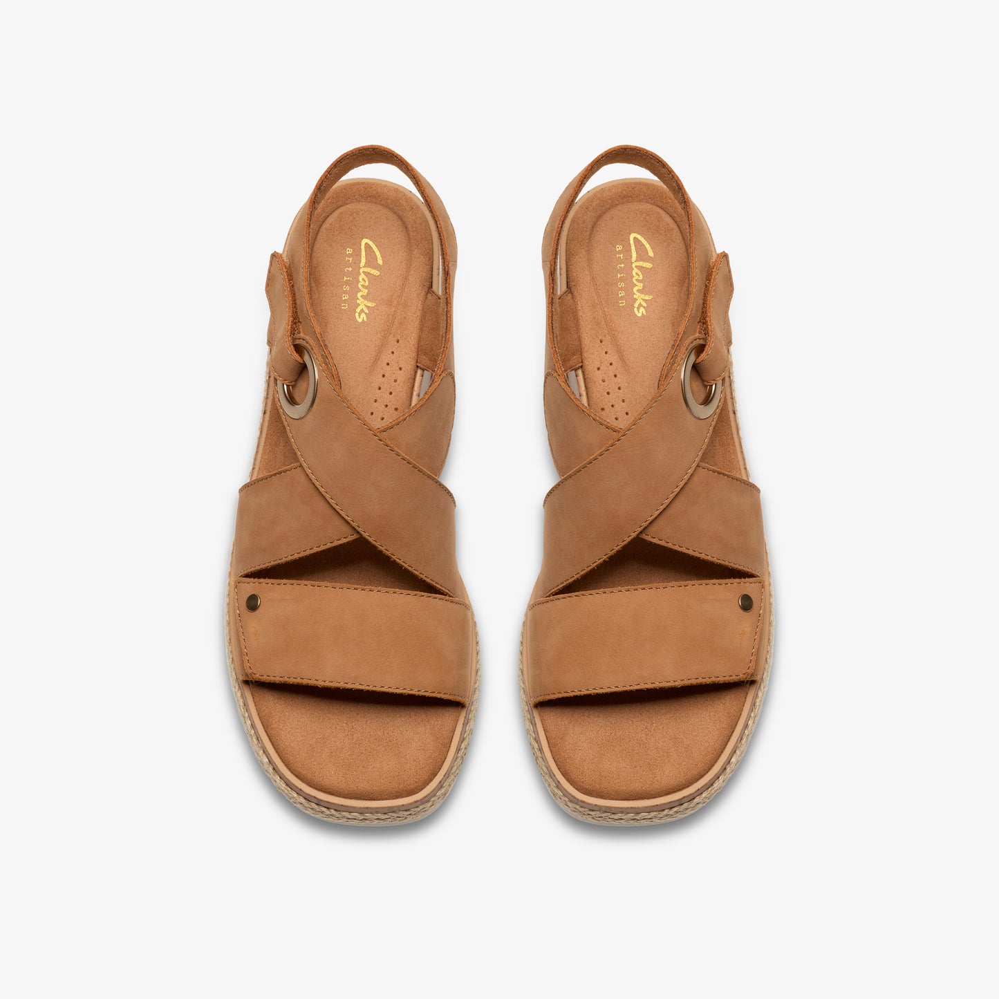 Pair of tan leather sandals with overlapping straps.