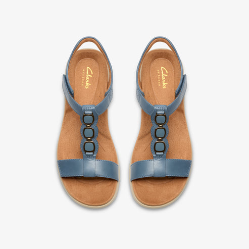 Two blue sandals with gold accents on a light brown sole, viewed from above.