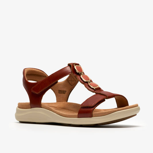 Reddish-brown sandal with three decorative circles
