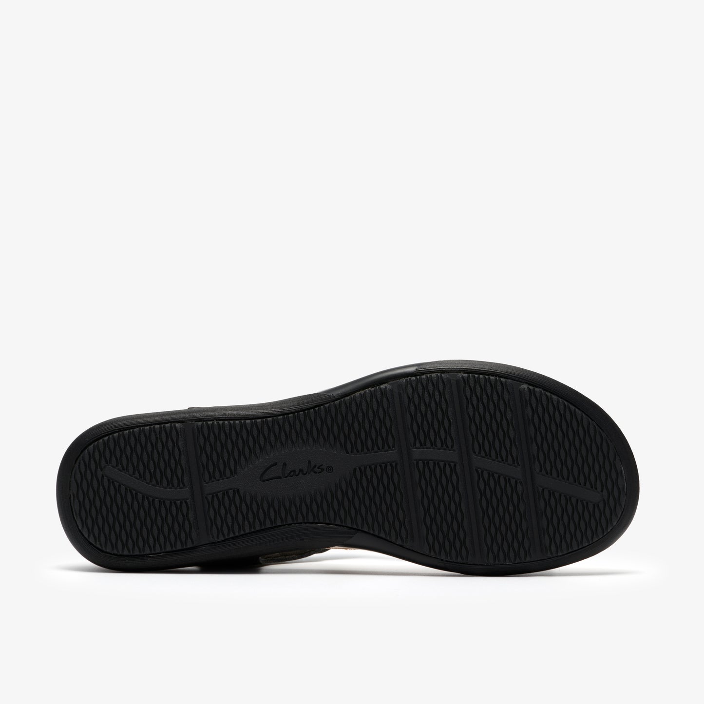 Black shoe sole with a grid pattern and the word clarks.
