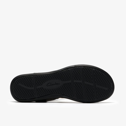 Black shoe sole with a grid pattern and the word clarks.