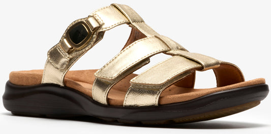 A gold sandal with multiple straps, a velcro closure, and a dark sole.