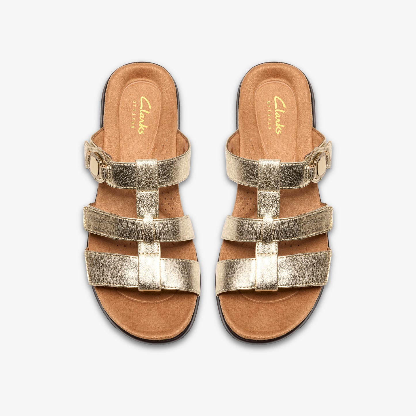 Overhead studio shot of metallic gold flat sandals with an adjustable buckled strap, t-strap, and two horizontal bands.