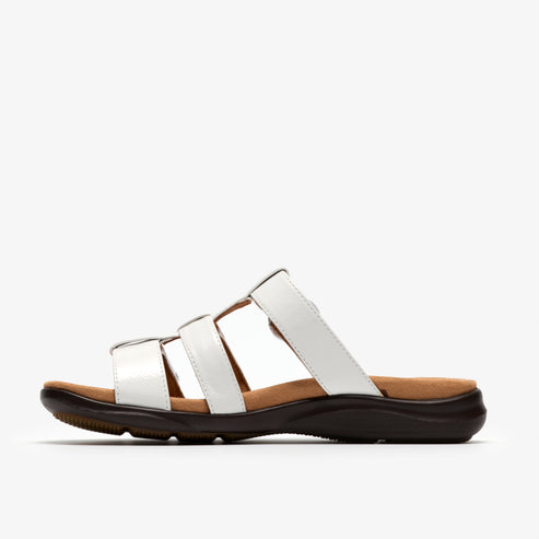 White sandal with a flat brown sole and three top straps.