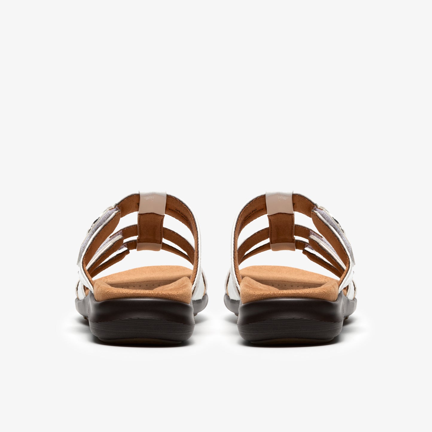 Pair of sandals seen from the back with multiple thin straps and dark soles.