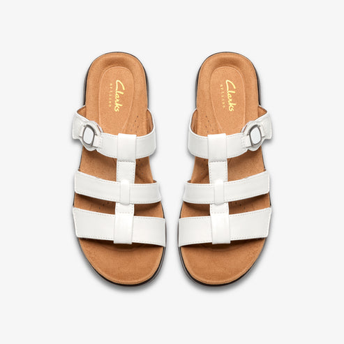 Top-down view of two white leather sandals, each with three straps and a brown insole marked with the word 'Clarks'.