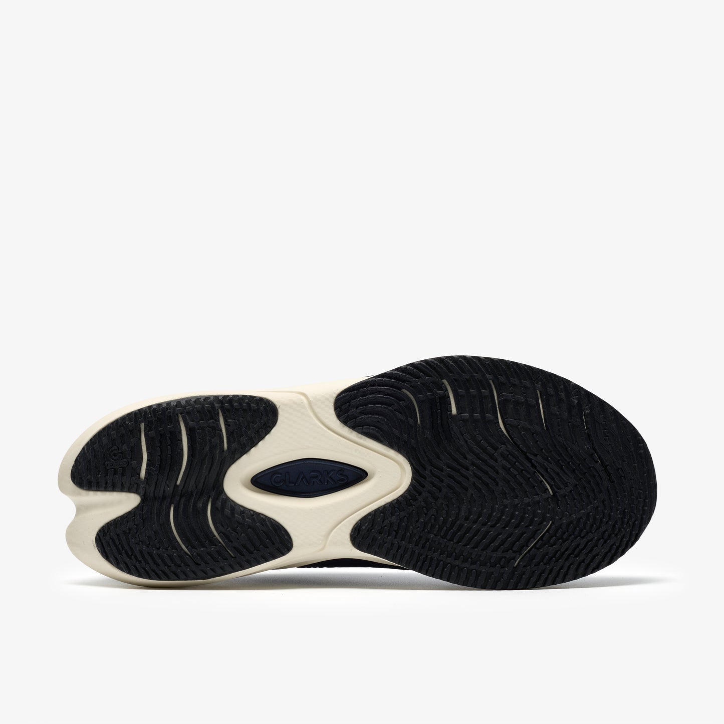 Shoe outsole with contrasting patterns and colors.