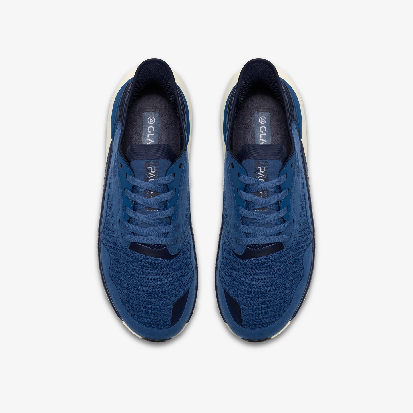 Overhead view of blue running shoes with white midsoles and CLAE branding on the insole.