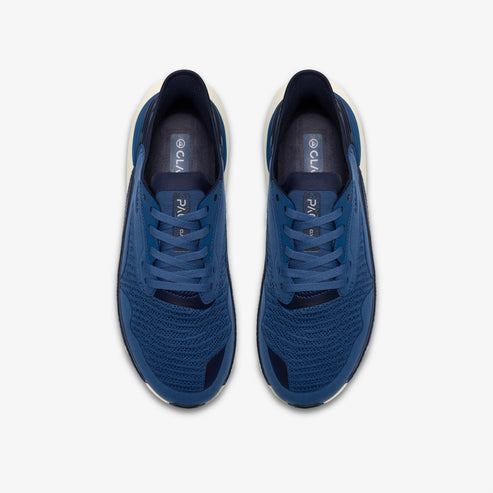 Overhead view of blue running shoes with white midsoles and CLAE branding on the insole.