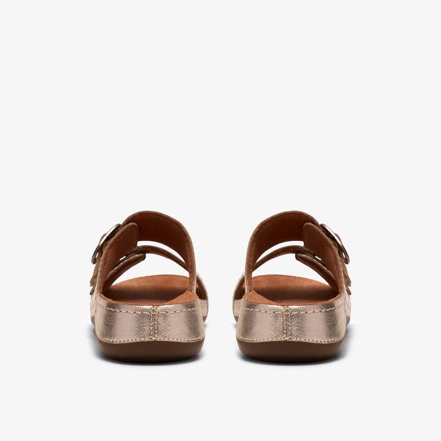 Pair of gold slip-on sandals with two buckled straps.