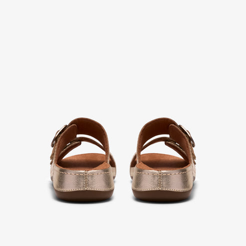 Pair of gold slip-on sandals with two buckled straps.