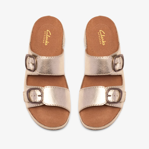 Pair of gold leather sandals with two straps and buckle closures.