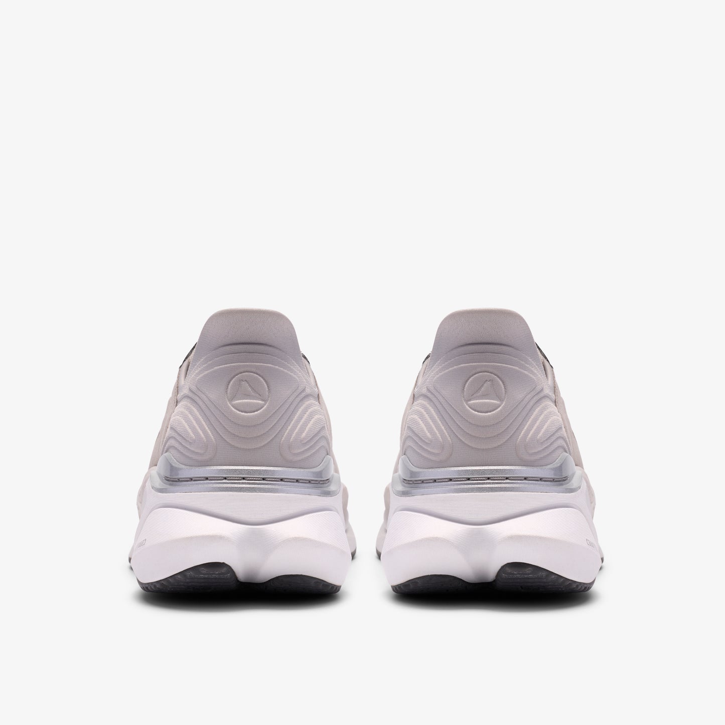 Rear view of two neutral running shoes, white with black soles.