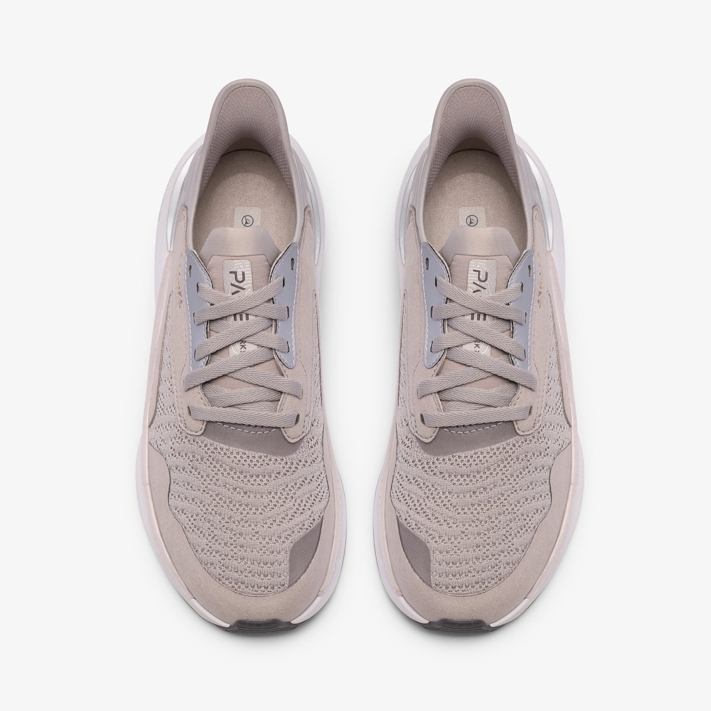 Pair of gray running shoes, top view.