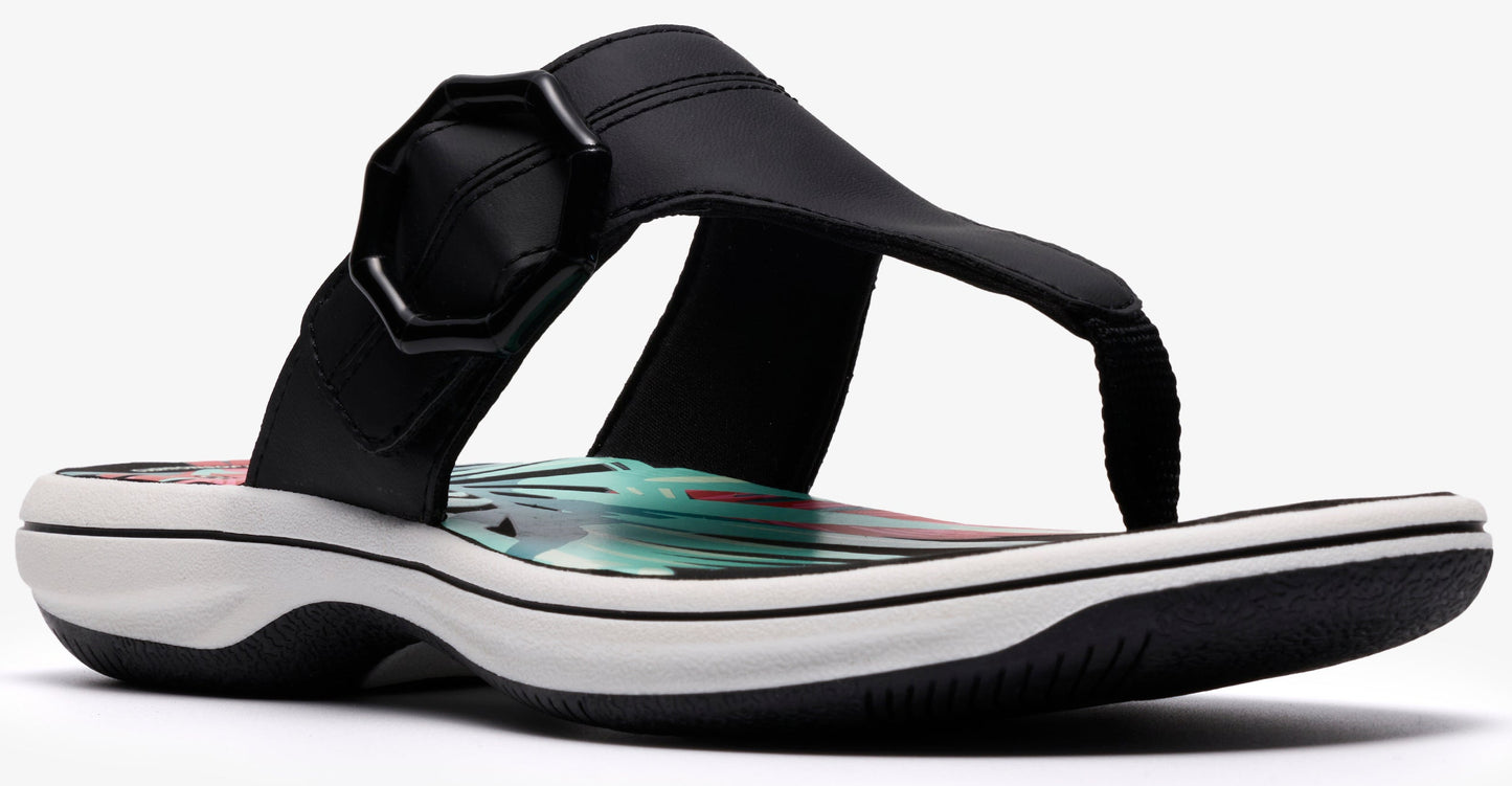 Black toe-thong sandal with an decorative upper and a white sole.