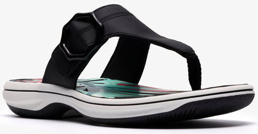 Black toe-thong sandal with an decorative upper and a white sole.
