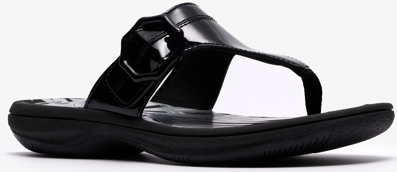 A black, shiny flip-flop sandal.
