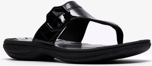 A black, shiny flip-flop sandal.