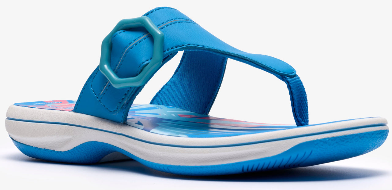 A blue sandal with a toe post and a decorative buckle.