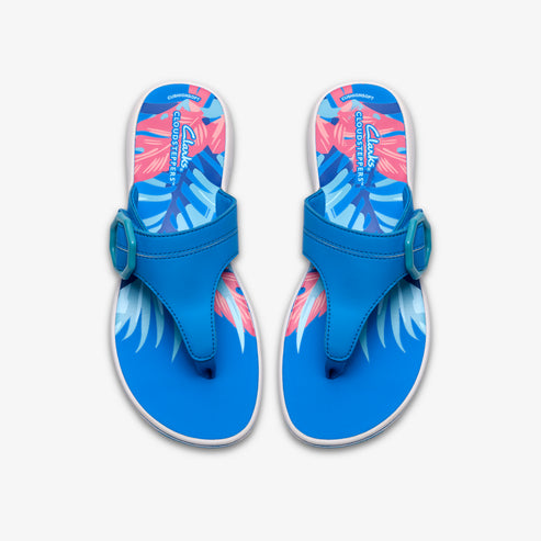 A pair of blue flip-flops with palm leaves pattern and buckle.
