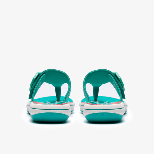 A pair of teal flip-flops with a bow.