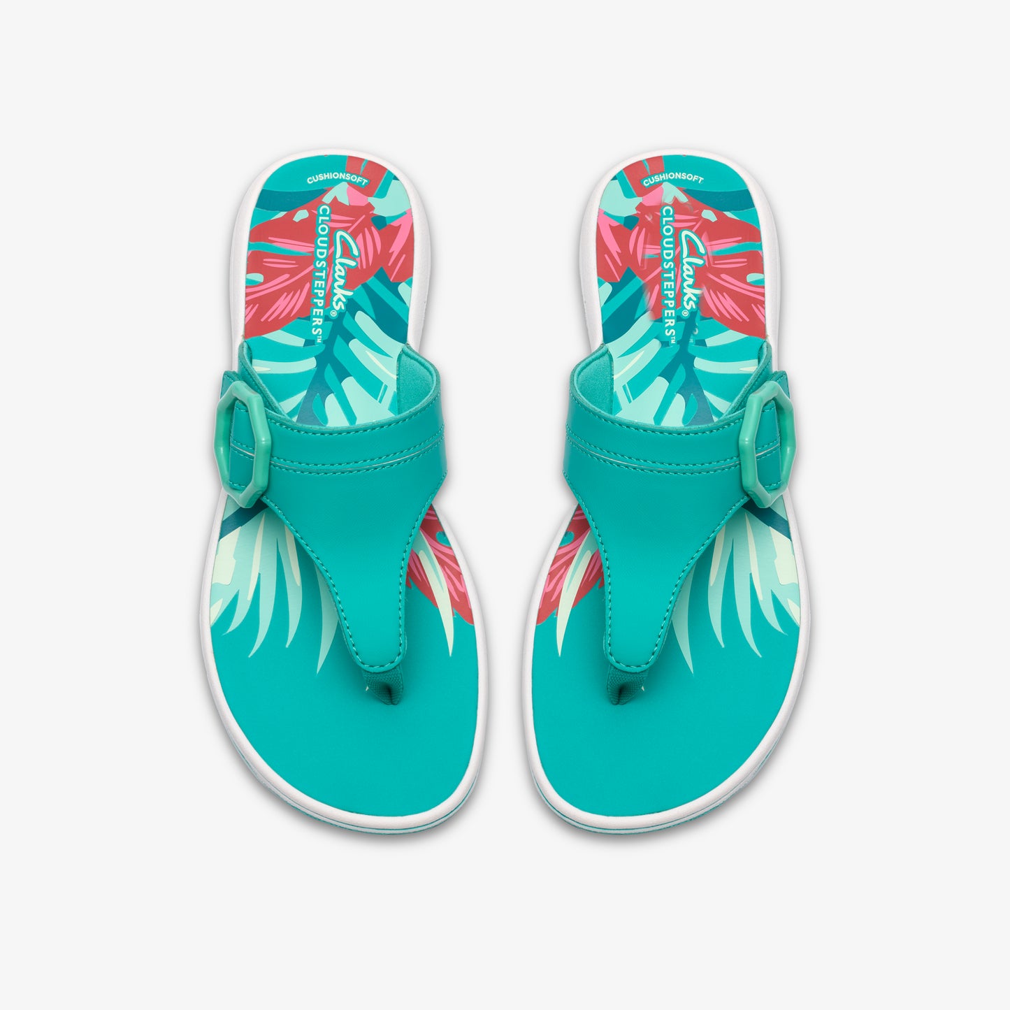 Pair of teal flip-flops with decorative buckle and floral design.